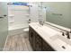 Modern bathroom with double vanity and shower/tub combo at 14139 W Gray Fox Trl, Surprise, AZ 85387