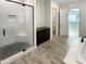 Modern bathroom with a walk-in shower and floating vanity at 14139 W Gray Fox Trl, Surprise, AZ 85387