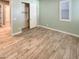 Charming bedroom with a closet and wood-look tile floors at 14139 W Gray Fox Trl, Surprise, AZ 85387