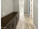 Long hallway with built-in cabinets and access to bathroom and bedrooms at 14139 W Gray Fox Trl, Surprise, AZ 85387