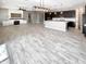 Open concept living area with kitchen and fireplace at 14139 W Gray Fox Trl, Surprise, AZ 85387