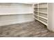 Large walk-in closet with ample shelving and hanging space at 14139 W Gray Fox Trl, Surprise, AZ 85387