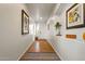 Bright entryway with wood-look floors and decorative wall art at 15211 N 184Th Ct, Surprise, AZ 85388