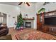 Cozy living area features a fireplace, hardwood floors, and a Christmas tree at 15211 N 184Th Ct, Surprise, AZ 85388