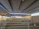 Covered horse stalls with metal fencing and sandy flooring at 2687 E Caitlin Way, San Tan Valley, AZ 85140