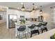 Modern kitchen with white cabinets, stainless steel appliances and island at 3222 S Piedra Ave, Mesa, AZ 85212