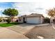 Single-story home with a two-car garage, driveway, and low-maintenance landscaping at 3279 E Woodside Way, Gilbert, AZ 85297