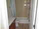 Bathroom with tub shower, toilet and wood vanity at 3434 W Danbury Dr # A204, Phoenix, AZ 85053