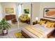 Bedroom with mid-century modern furniture and yellow bedding at 3434 W Danbury Dr # A204, Phoenix, AZ 85053