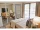 Bedroom with mirrored closet doors and light bedding at 3434 W Danbury Dr # A204, Phoenix, AZ 85053