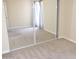 Simple bedroom with mirrored closet doors and neutral carpeting at 3434 W Danbury Dr # A204, Phoenix, AZ 85053
