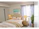 Bedroom with wicker furniture and beach-themed art at 3434 W Danbury Dr # A204, Phoenix, AZ 85053