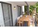 Private patio with wooden dining table and chairs at 3434 W Danbury Dr # A204, Phoenix, AZ 85053