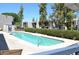 Community pool with surrounding patio furniture at 3434 W Danbury Dr # A204, Phoenix, AZ 85053