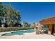Inviting swimming pool and spa area with lounge chairs at 3434 W Danbury Dr # A204, Phoenix, AZ 85053