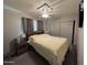 Bright bedroom with ceiling fan, double closet, and ample space at 4065 E University Dr # 276, Mesa, AZ 85205