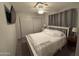 Second bedroom with ceiling fan and double closet at 4065 E University Dr # 276, Mesa, AZ 85205