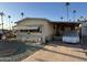 Front view of a mobile home with a covered carport at 4065 E University Dr # 276, Mesa, AZ 85205