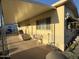 Mobile home with covered porch and a small bench at 4065 E University Dr # 276, Mesa, AZ 85205