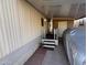 Covered entrance with steps leading to the front door at 4065 E University Dr # 276, Mesa, AZ 85205