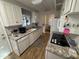 Efficient kitchen with light cabinets, granite counters, and appliances at 4065 E University Dr # 276, Mesa, AZ 85205