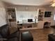 Living room with built-in shelving and workspace at 4065 E University Dr # 276, Mesa, AZ 85205