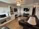 Spacious living area featuring built-in shelving and a comfortable sofa at 4065 E University Dr # 276, Mesa, AZ 85205
