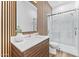 Modern bathroom with wood slat wall and glass shower at 4220 N 32Nd St # 3, Phoenix, AZ 85018