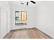 Bright bedroom with wood floors, large window, and ceiling fan at 4220 N 32Nd St # 3, Phoenix, AZ 85018