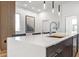Modern kitchen island with white countertops and wood cabinets at 4220 N 32Nd St # 3, Phoenix, AZ 85018