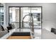 Modern kitchen with a sleek, stainless steel faucet and white countertops at 4220 N 32Nd St # 3, Phoenix, AZ 85018