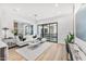 Bright living room with white sofa and large sliding glass doors at 4220 N 32Nd St # 3, Phoenix, AZ 85018
