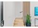 Modern staircase with wood steps and a sleek handrail at 4220 N 32Nd St # 3, Phoenix, AZ 85018