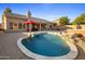 Stunning backyard oasis featuring a kidney-shaped pool and spa at 4935 E Dale Ln, Cave Creek, AZ 85331