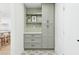 Laundry room with green cabinets and geometric tile floor at 5030 E Winchcomb Dr, Scottsdale, AZ 85254