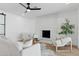 Living room with fireplace and sliding glass doors to backyard at 5030 E Winchcomb Dr, Scottsdale, AZ 85254