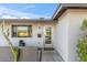 Modern front entrance with glass door, updated mailbox, and small cacti garden at 6643 E Vernon Ave, Scottsdale, AZ 85257