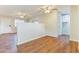 Dining area with hardwood floors and kitchen access at 707 N 92Nd Pl, Mesa, AZ 85207