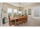 Bright dining room with a wooden table and chairs at 7103 W Turnstone Dr, Florence, AZ 85132