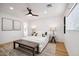 Main bedroom with light and airy feel, featuring wood flooring and ceiling fan at 8313 E Rancho Vista Dr, Scottsdale, AZ 85251