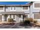 Front view of a two-story townhome with gray exterior and landscaping at 860 N Mcqueen Rd # 1178, Chandler, AZ 85225