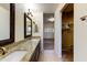 Double vanity bathroom with granite countertop and large mirror at 8653 E Royal Palm Rd # 2005, Scottsdale, AZ 85258