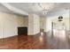 Spacious living area with hardwood floors and built-in cabinetry at 8653 E Royal Palm Rd # 2005, Scottsdale, AZ 85258