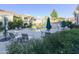 Community pool with lounge chairs and umbrellas at 8653 E Royal Palm Rd # 2005, Scottsdale, AZ 85258