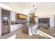 Bright and airy kitchen with a large island and wine refrigerator at 9983 E Mirabel Club Dr, Scottsdale, AZ 85262