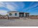 New construction home with a modern design and a landscaped yard at 11404 S 208Th Ave, Buckeye, AZ 85326