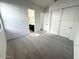 Bright bedroom with carpet flooring and spacious closet at 11512 E Utah Ave, Mesa, AZ 85212