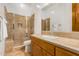 Bathroom with shower, toilet and wooden vanity at 11557 E Four Peaks Rd, Scottsdale, AZ 85262