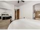 Guest bedroom with mirrored closet doors and ensuite bath at 11557 E Four Peaks Rd, Scottsdale, AZ 85262