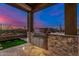 Outdoor kitchen with stainless steel appliances and a stone facade at 11557 E Four Peaks Rd, Scottsdale, AZ 85262